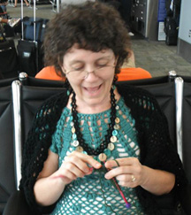 Here I am in the airport, excited about learning to knit!